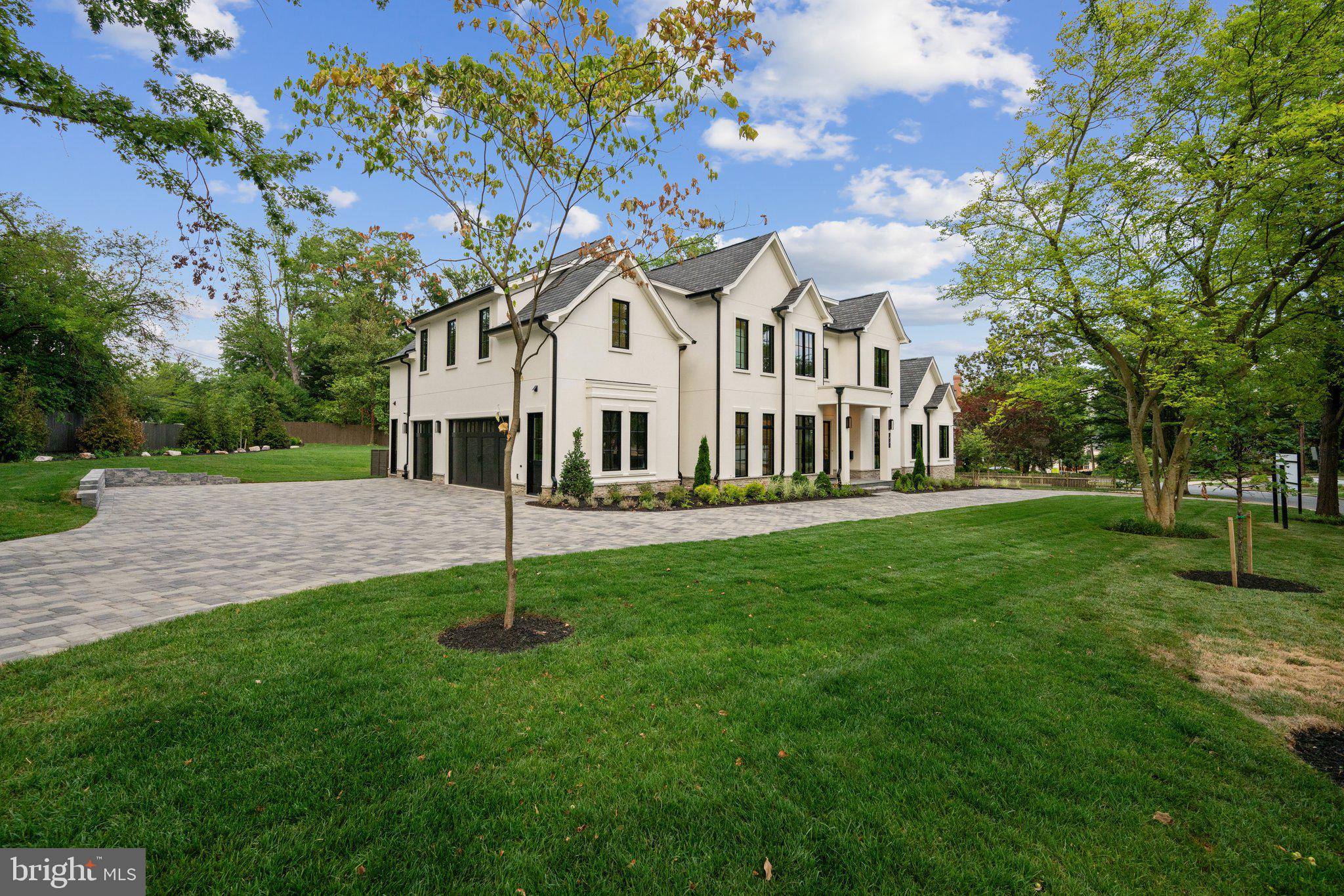 5425 Moorland Lane Bethesda, MD 20814 - Photo 74 of 79 a house that is sitting in the grass