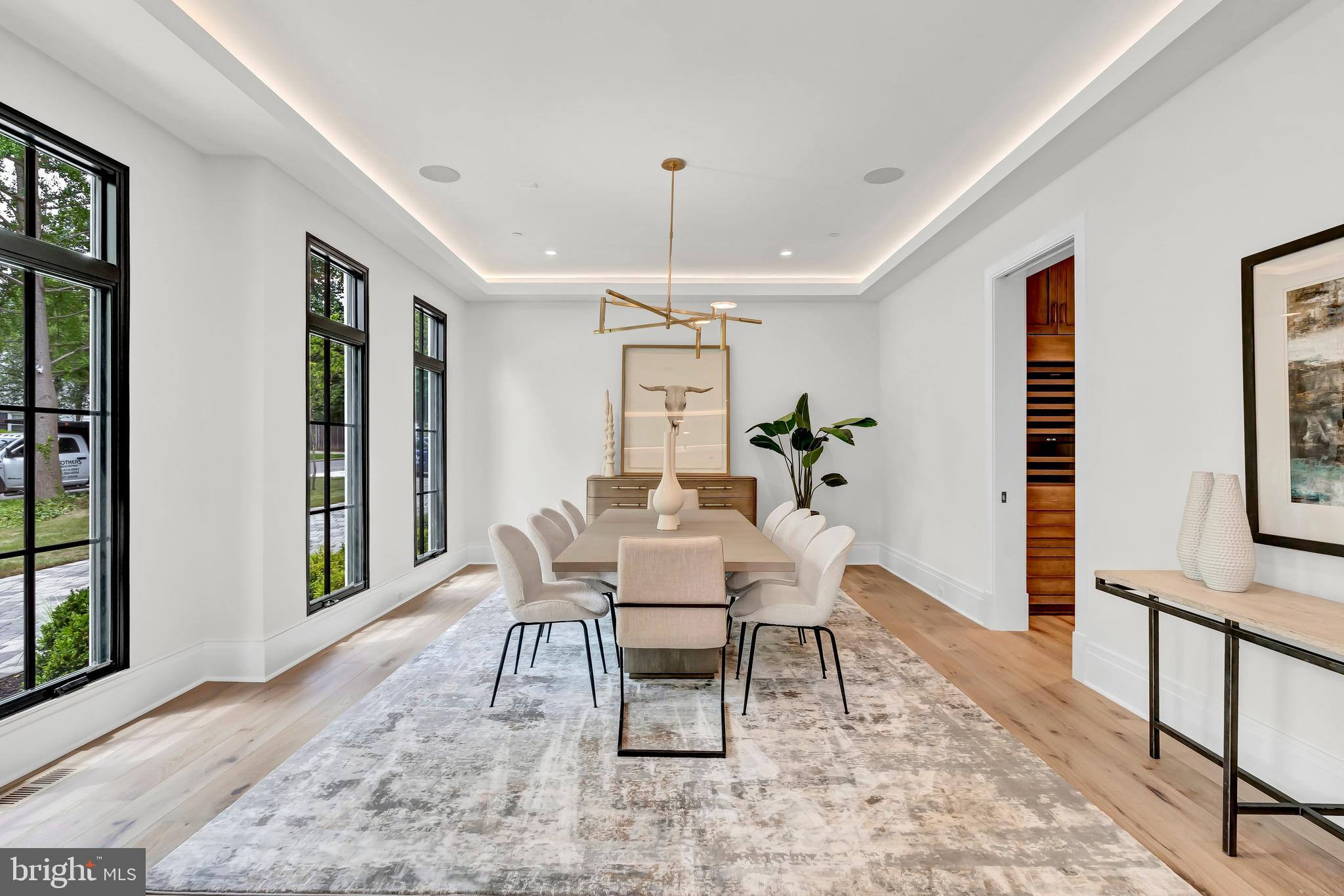 5425 Moorland Lane Bethesda, MD 20814 - Photo 9 of 79 a dining room with furniture potted plants and wooden floor