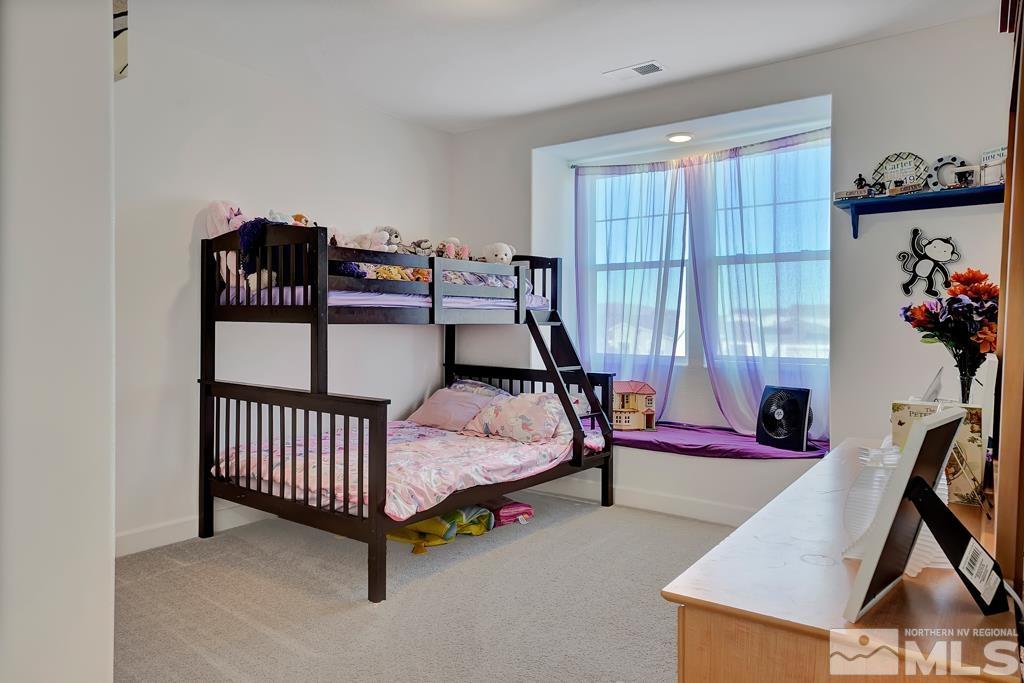 929 Estuary Circle Reno, NV 89506 - Photo 14 of 30 a bedroom with furniture and a window
