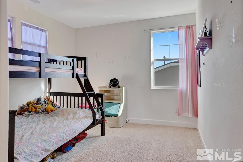 929 Estuary Circle Reno, NV 89506 - Photo 15 of 30 a bedroom with furniture and a window