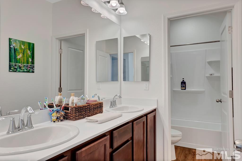 929 Estuary Circle Reno, NV 89506 - Photo 17 of 30 a bathroom with a sink and a mirror