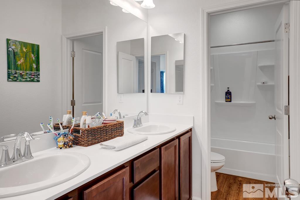 929 Estuary Circle Reno, NV 89506 - Photo 21 of 30 a bathroom with a sink and a mirror