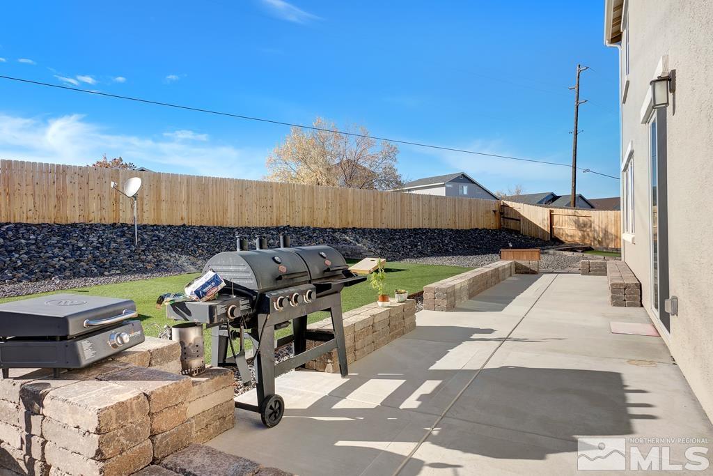 929 Estuary Circle Reno, NV 89506 - Photo 22 of 30 a view of a patio with a table and chairs