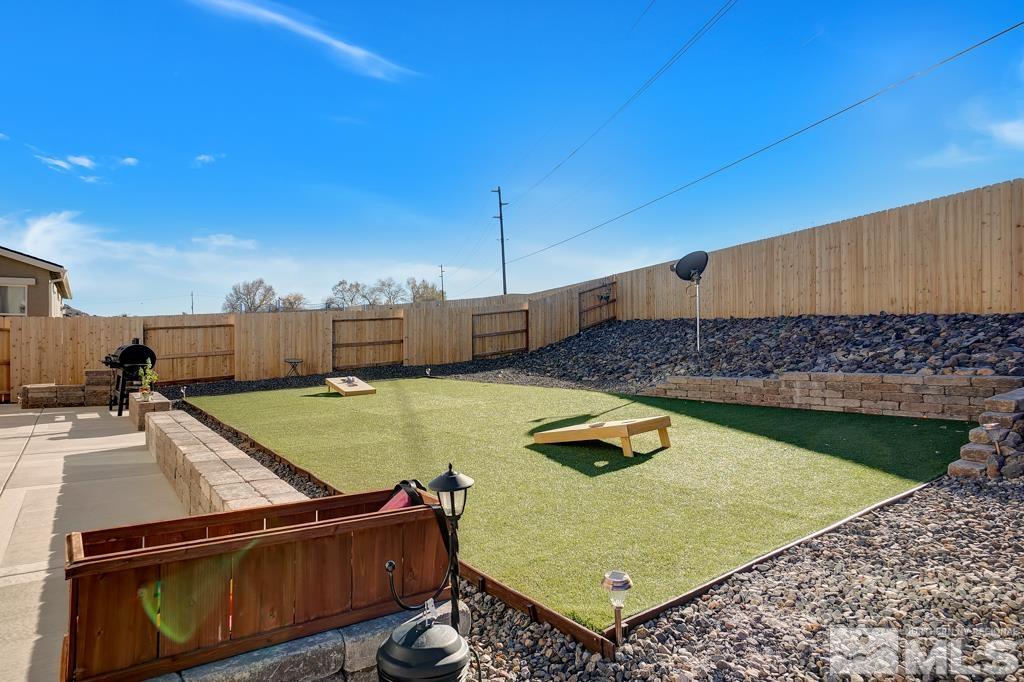 929 Estuary Circle Reno, NV 89506 - Photo 23 of 30 a view of a swimming pool with a lounge chairs