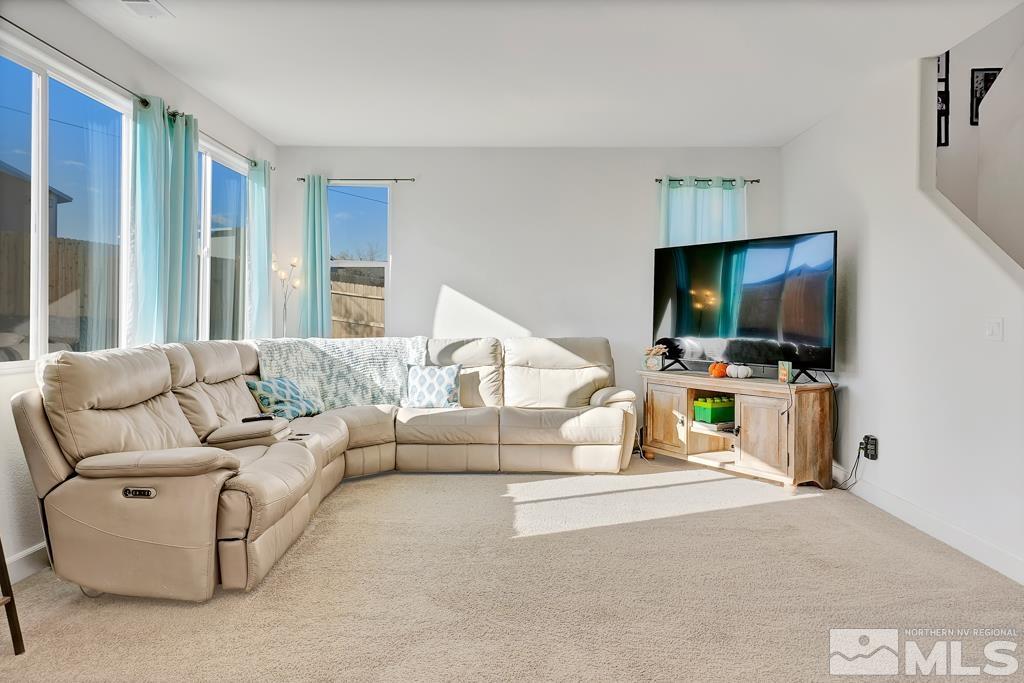 929 Estuary Circle Reno, NV 89506 - Photo 5 of 30 a living room with furniture and a flat screen tv