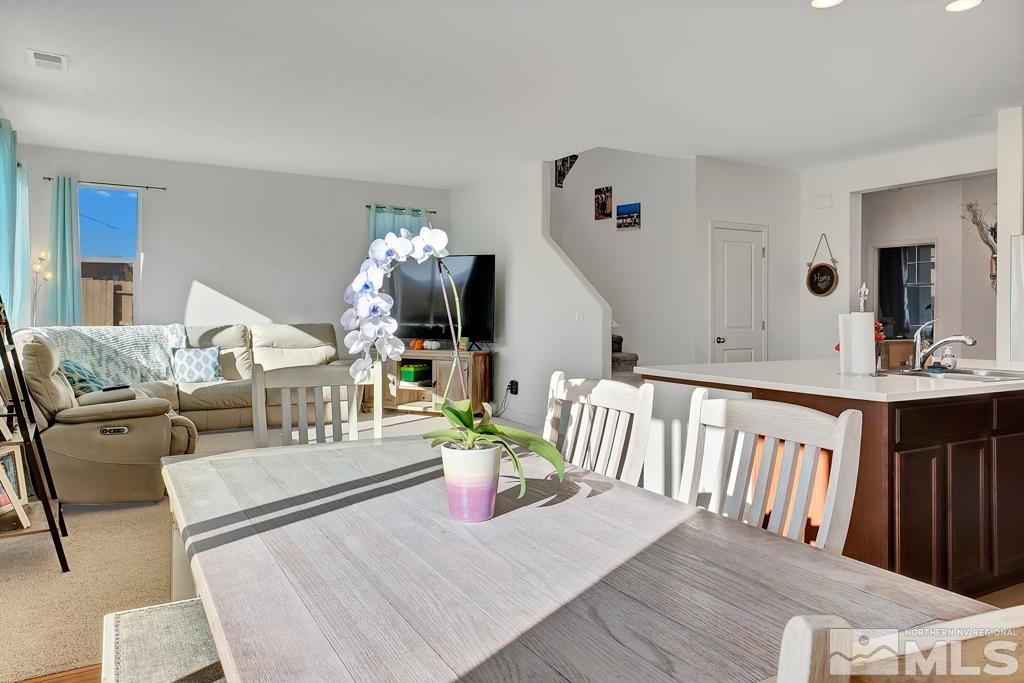929 Estuary Circle Reno, NV 89506 - Photo 7 of 30 a living room with furniture fireplace and wooden floor