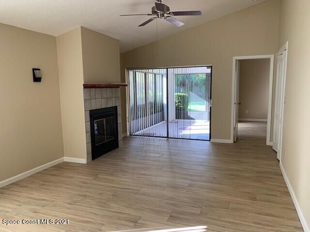381 Myrtlewood Road Melbourne, FL 32940 - Photo 14 of 31 a view of an empty room with a fireplace and a window