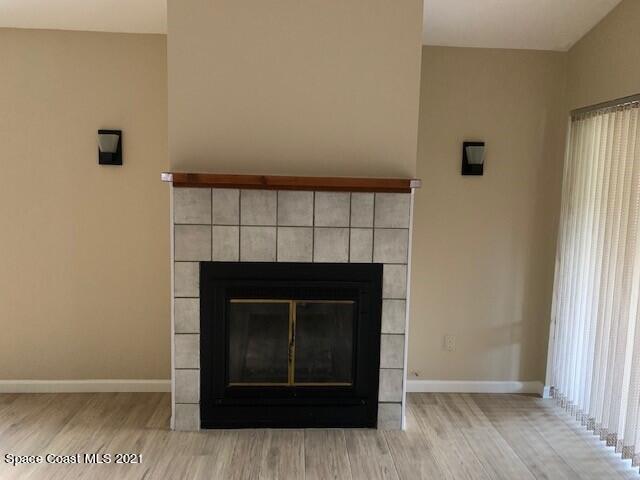 381 Myrtlewood Road Melbourne, FL 32940 - Photo 15 of 31 a view of an empty room with wooden floor and a window