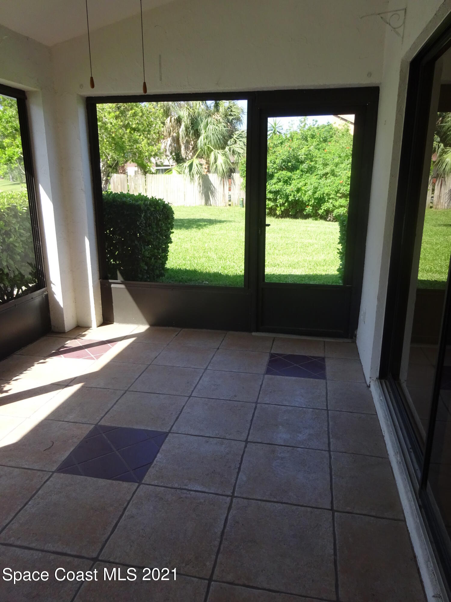381 Myrtlewood Road Melbourne, FL 32940 - Photo 16 of 31 a view of an empty room with a window