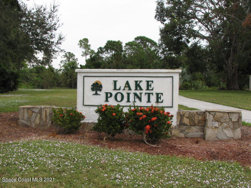 381 Myrtlewood Road Melbourne, FL 32940 - Photo 3 of 31 a sign that is sitting in front of a tree