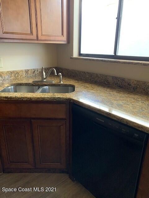 381 Myrtlewood Road Melbourne, FL 32940 - Photo 10 of 31 a kitchen with granite countertop cabinets and sink