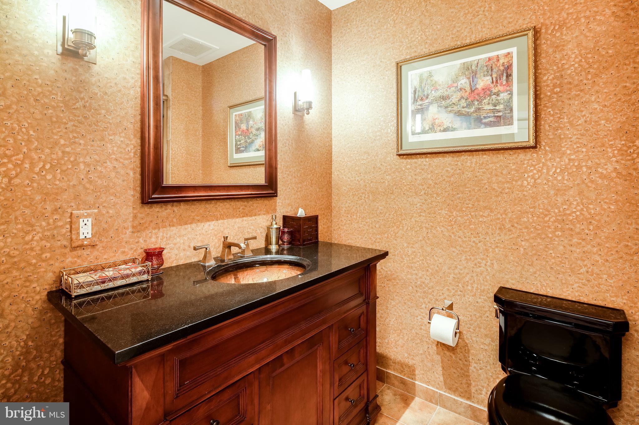 10 East Lee Street, Unit 1802 Baltimore, MD 21202 - Photo 16 of 21 a bathroom with a sink and a mirror