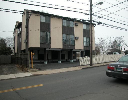235 Cove Road, Unit 4 Stamford, CT 06902 - Photo 1 of 1 a car parked in front of a house