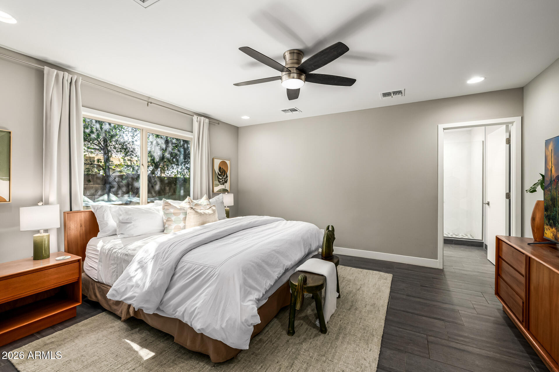 6726 North 11th Street Phoenix, AZ 85014 - Photo 19 of 49 a bedroom with a bed and a large window