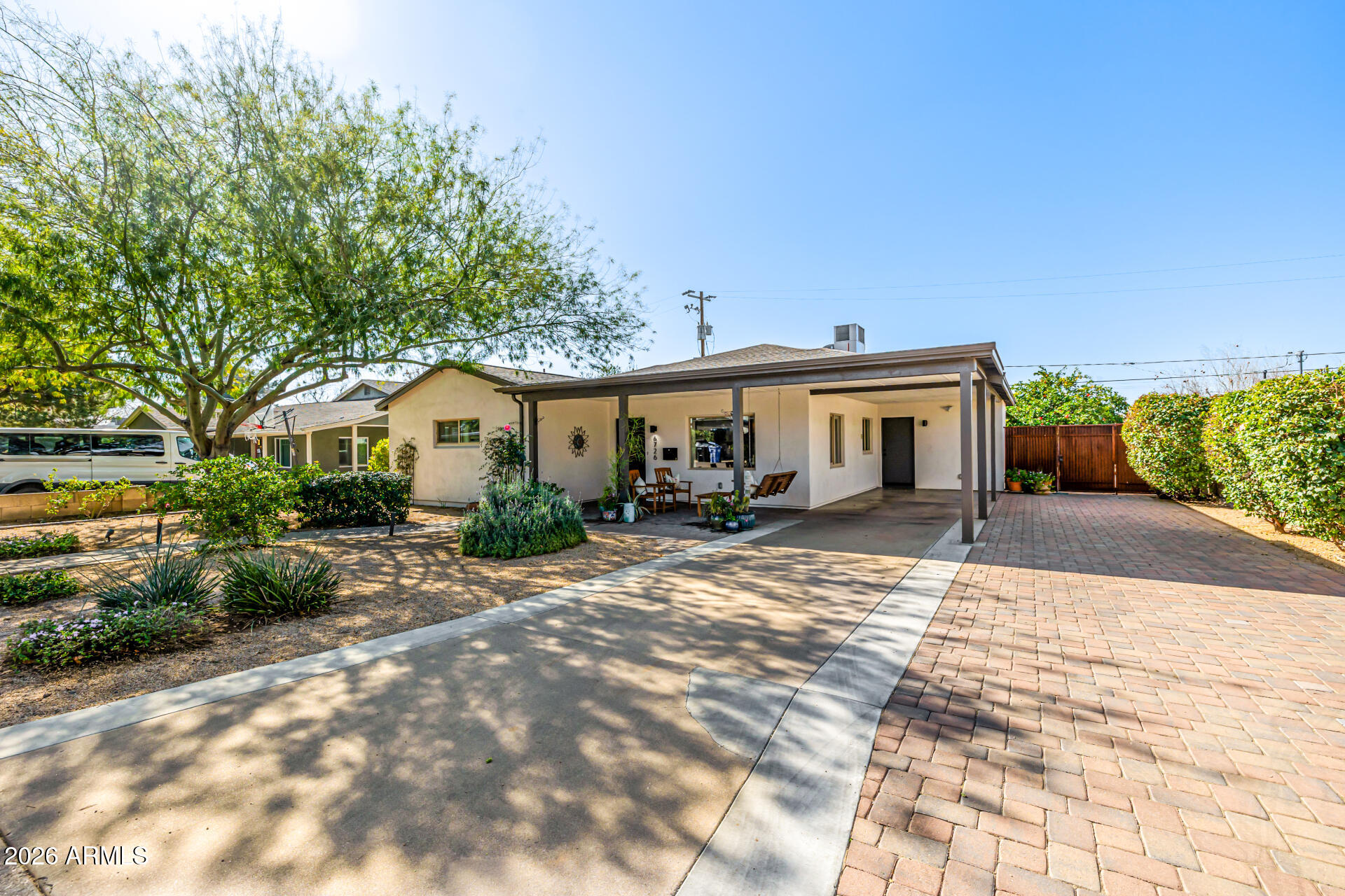 6726 North 11th Street Phoenix, AZ 85014 - Photo 2 of 49 a front view of a house with a garden