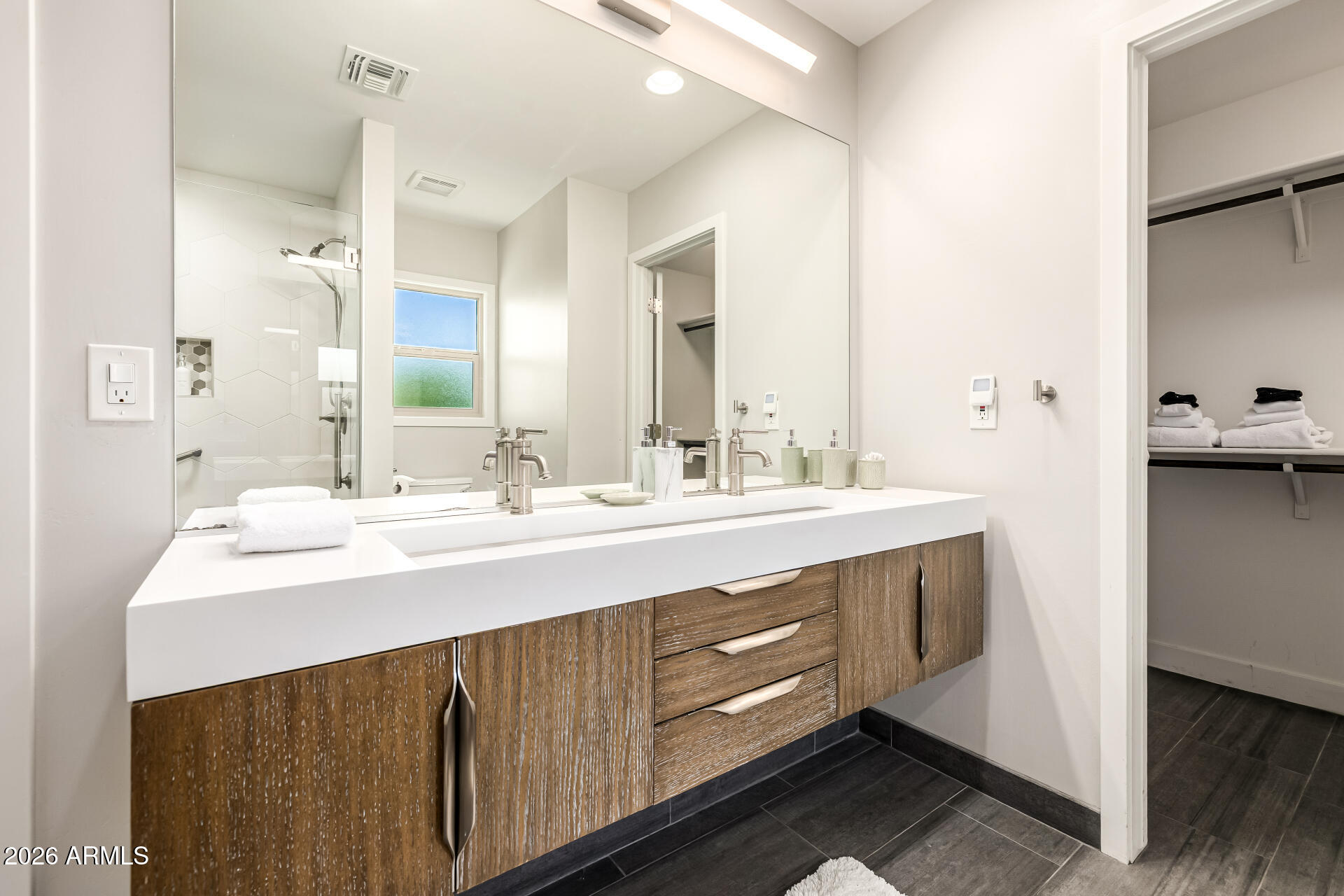 6726 North 11th Street Phoenix, AZ 85014 - Photo 23 of 49 a bathroom with a sink double vanity and a mirror