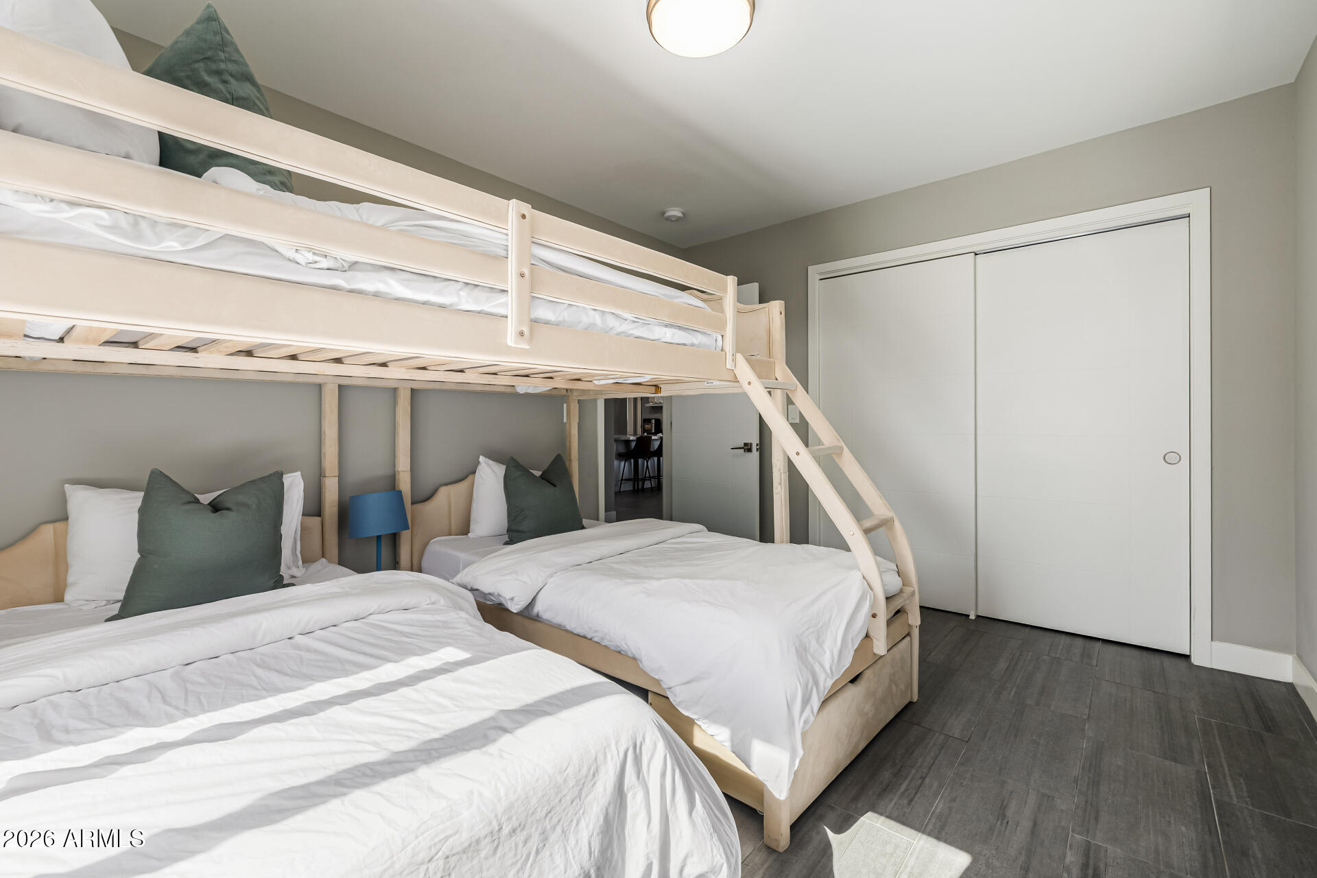 6726 North 11th Street Phoenix, AZ 85014 - Photo 30 of 49 a bedroom with two beds and a ceiling fan