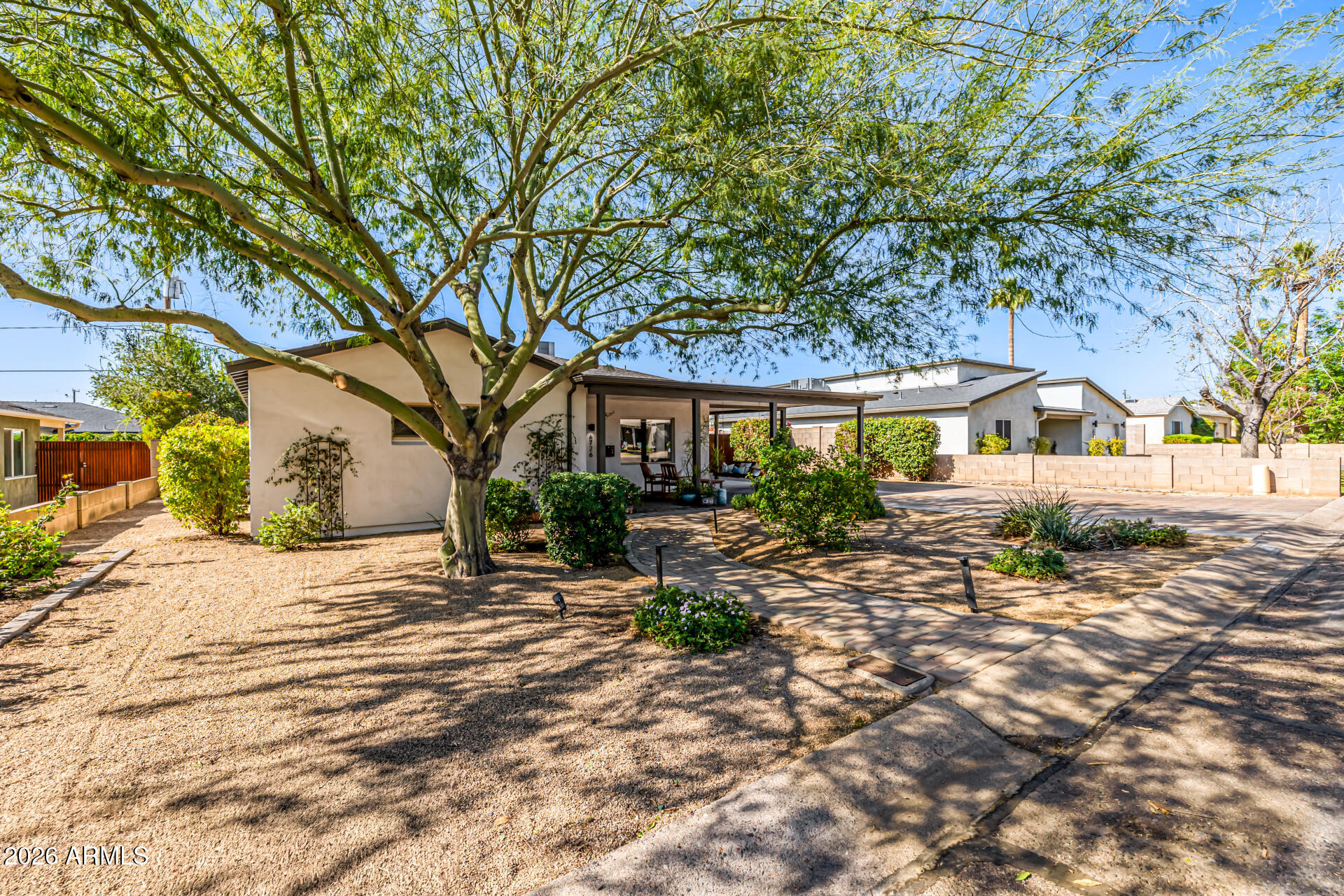 6726 North 11th Street Phoenix, AZ 85014 - Photo 3 of 49 a view of a house with a tree in the background