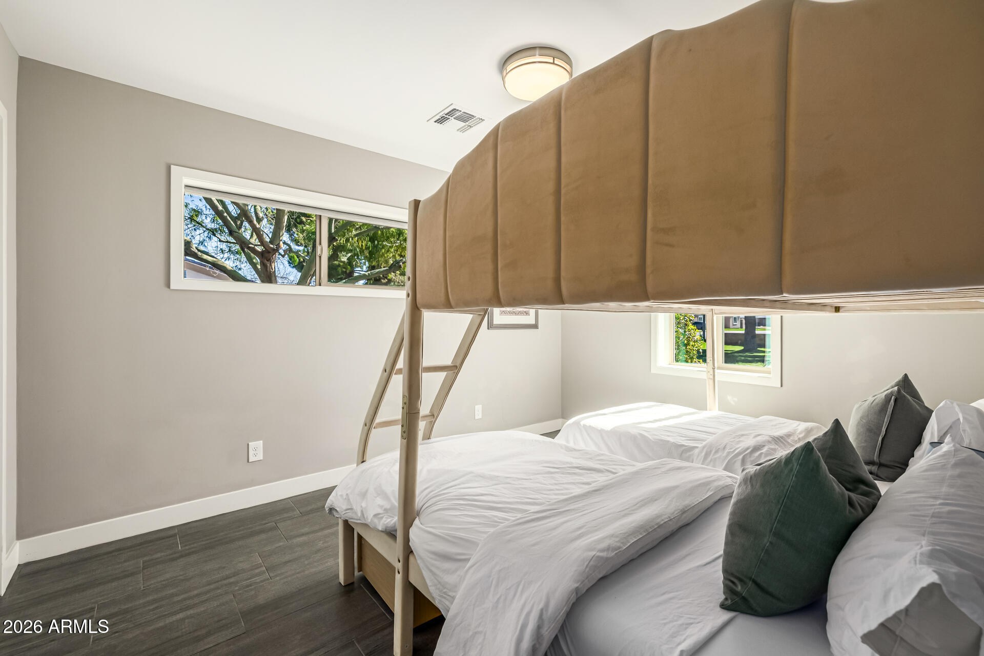 6726 North 11th Street Phoenix, AZ 85014 - Photo 31 of 49 a bed sitting in a bedroom next to a window