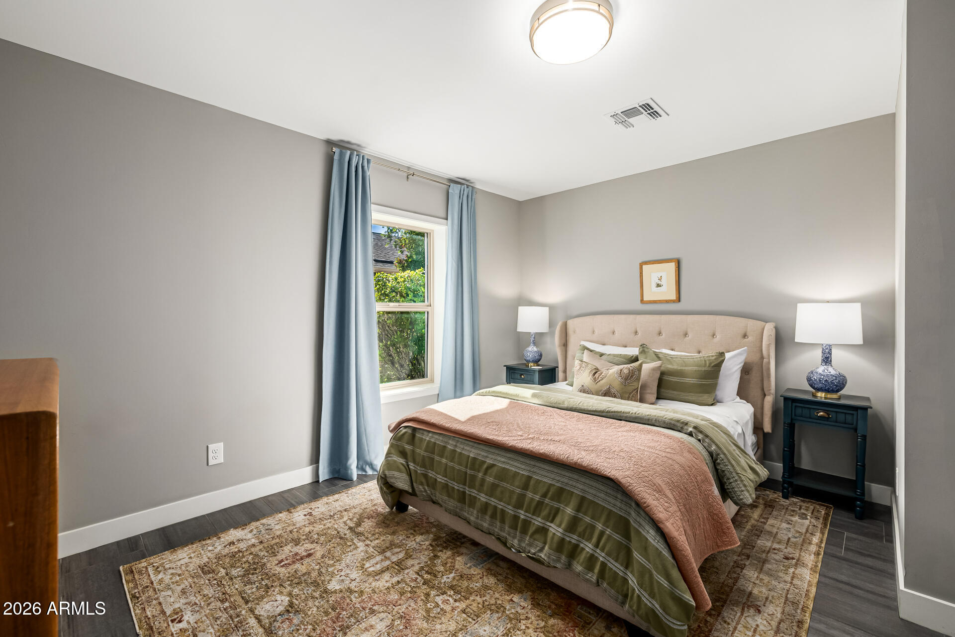 6726 North 11th Street Phoenix, AZ 85014 - Photo 32 of 49 a bedroom with a bed and a window