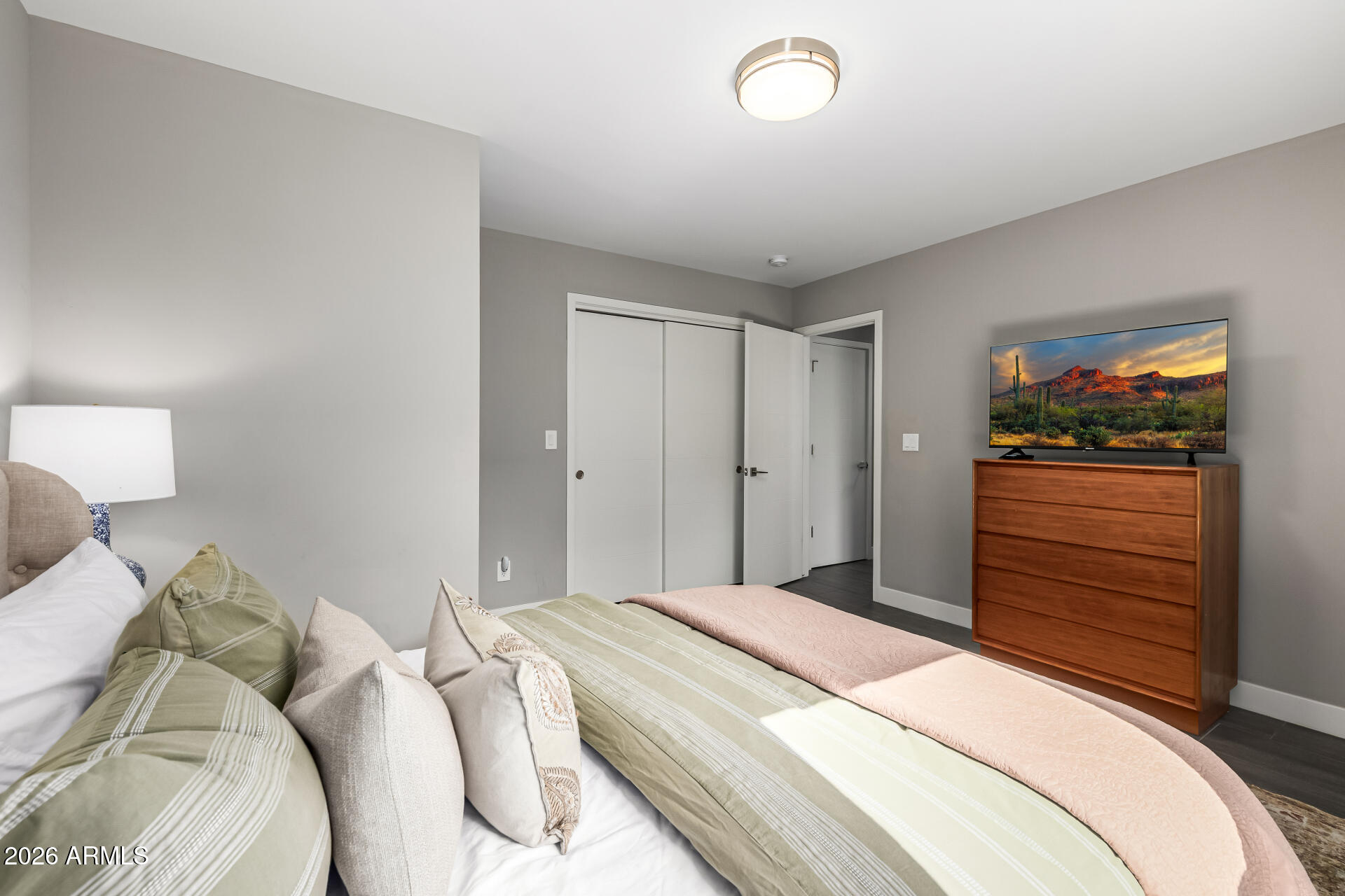 6726 North 11th Street Phoenix, AZ 85014 - Photo 33 of 49 a bedroom with a bed and a dresser