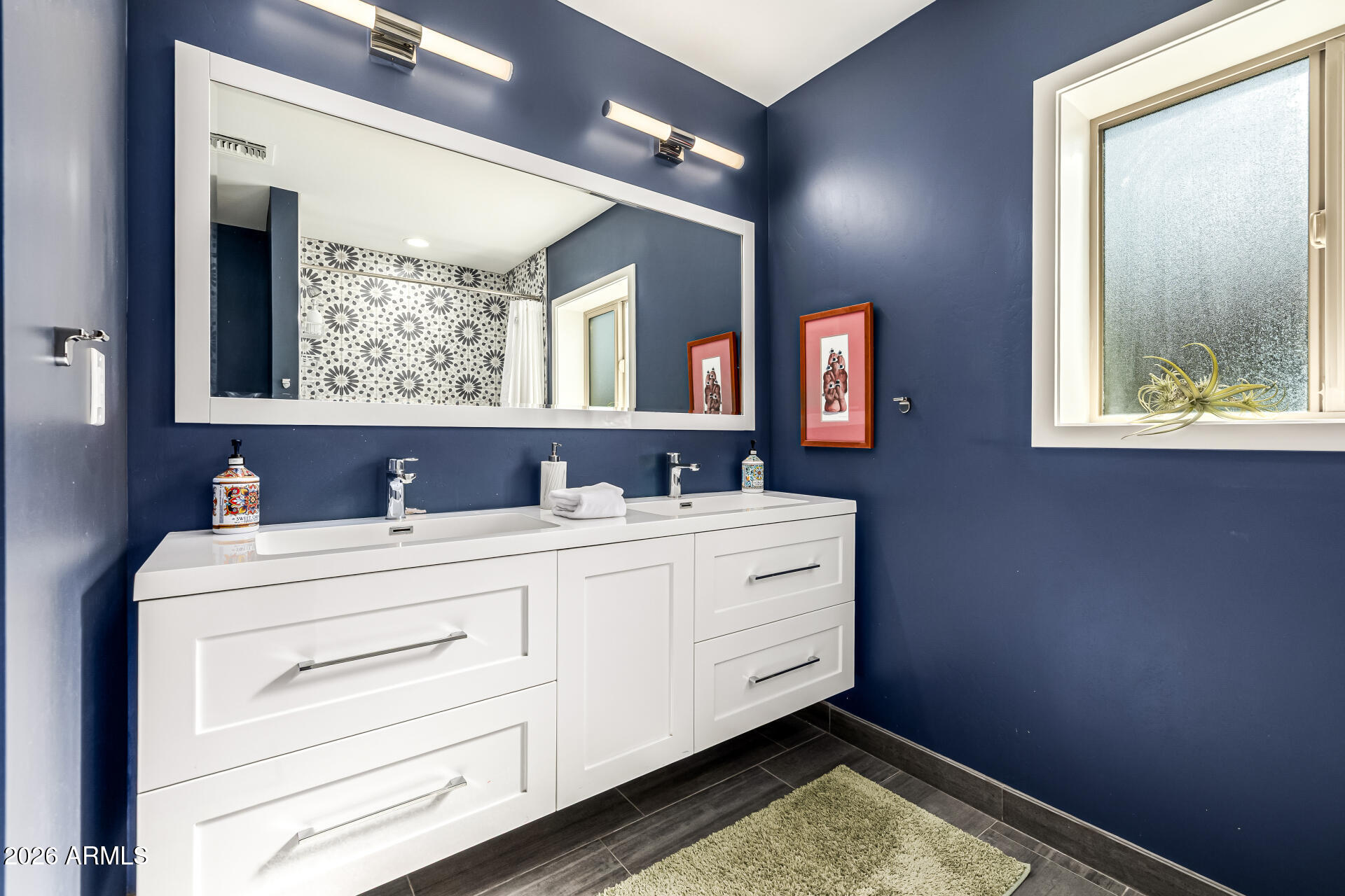 6726 North 11th Street Phoenix, AZ 85014 - Photo 34 of 49 a bathroom with a sink mirror and window