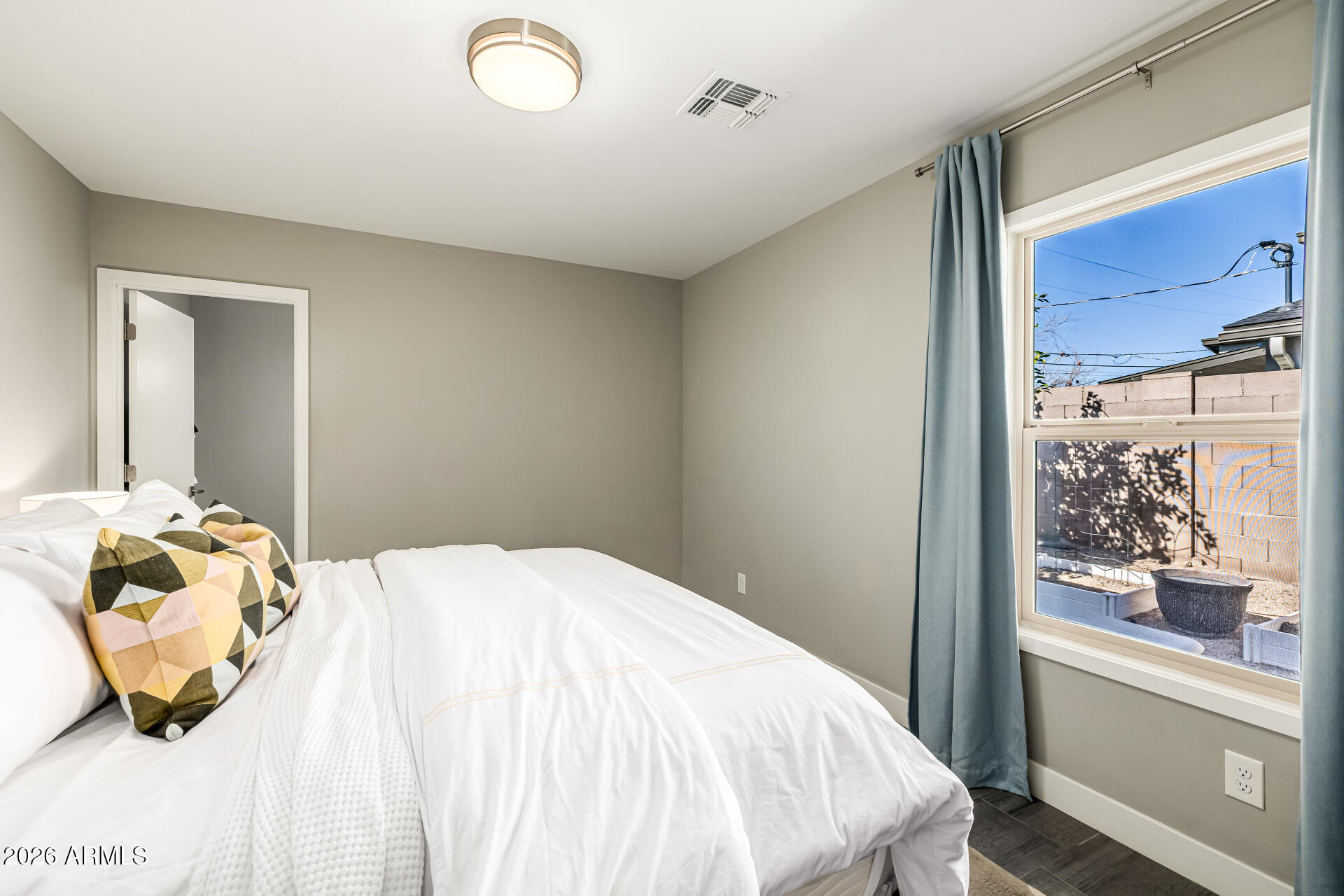 6726 North 11th Street Phoenix, AZ 85014 - Photo 36 of 49 a bedroom with a bed and a window