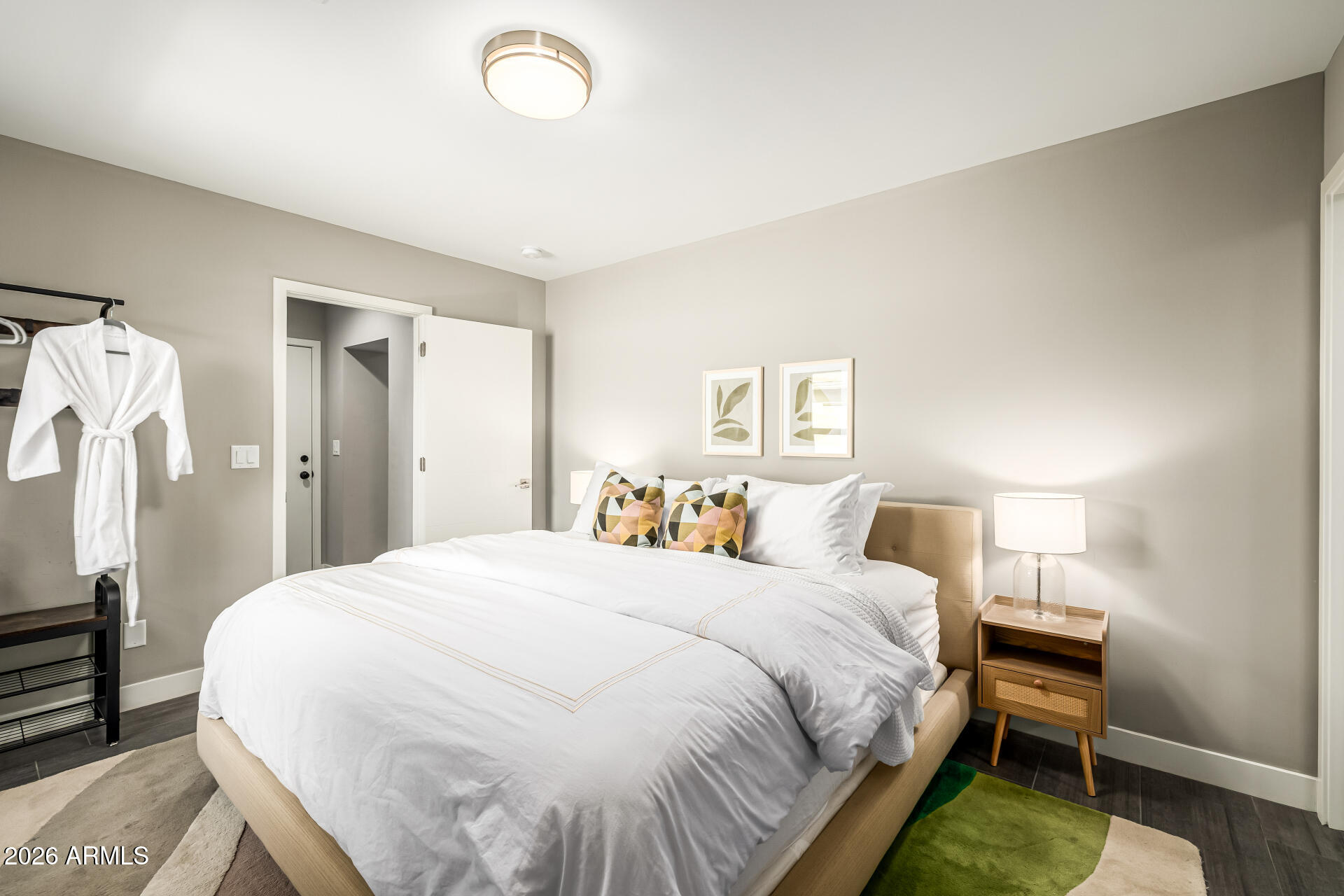 6726 North 11th Street Phoenix, AZ 85014 - Photo 37 of 49 a bedroom with a bed and a table