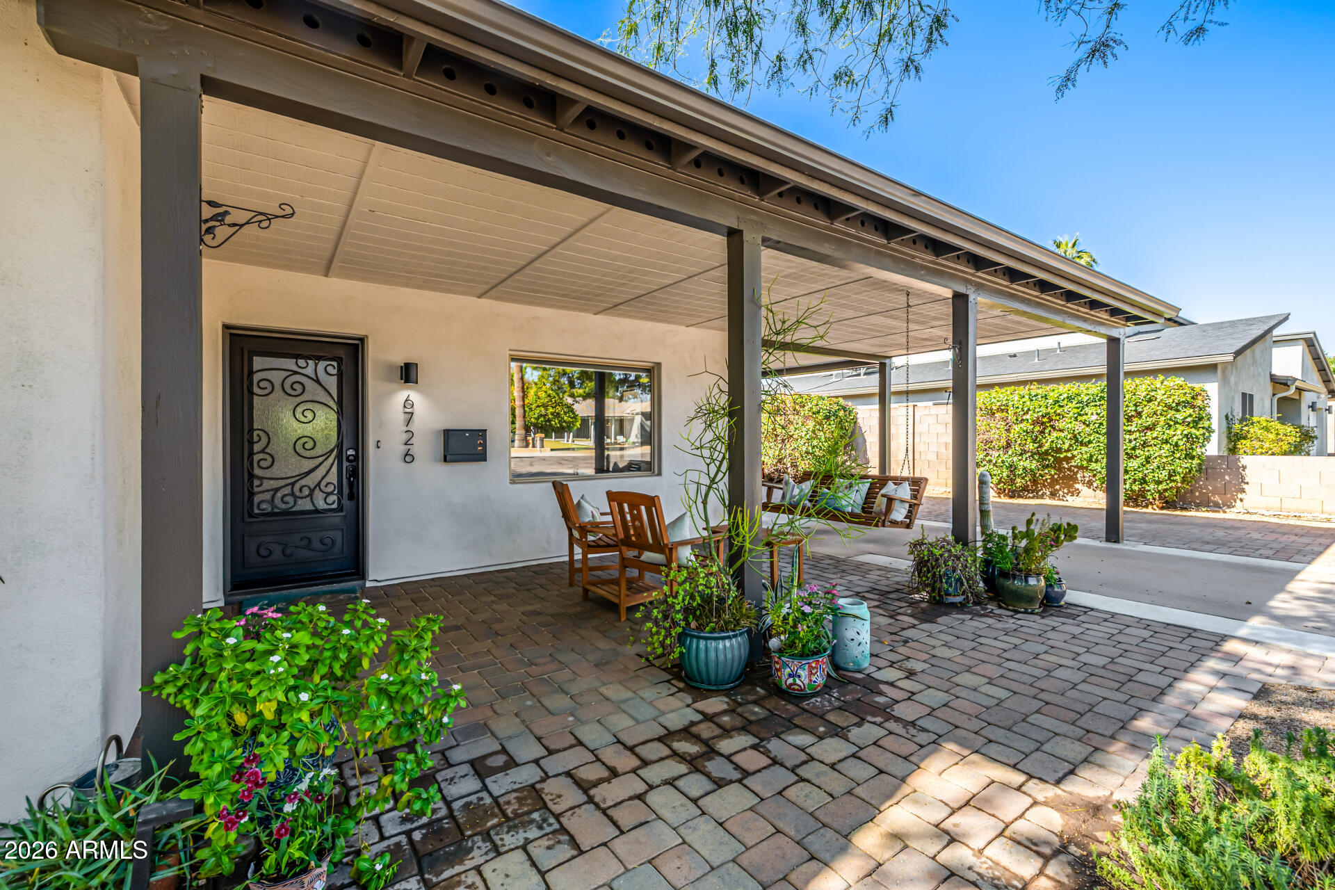 6726 North 11th Street Phoenix, AZ 85014 - Photo 5 of 49 a front view of a house with garden
