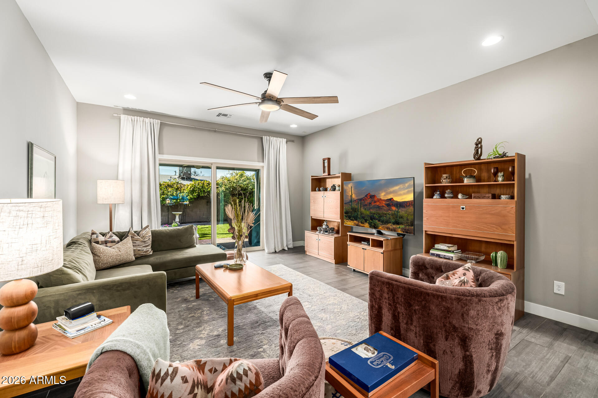 6726 North 11th Street Phoenix, AZ 85014 - Photo 10 of 49 a living room with furniture and a flat screen tv