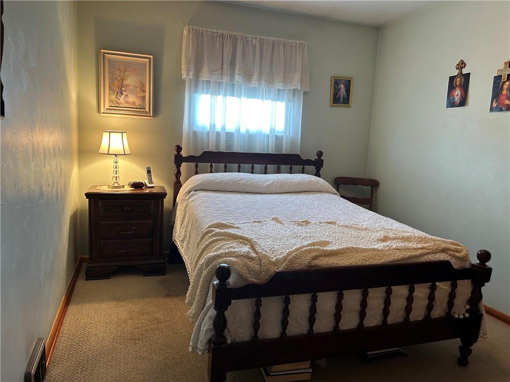 356 3rd Street Smithton, PA 15479 - Photo 11 of 21 a bedroom with a bed and a window