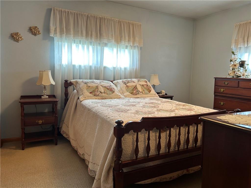 356 3rd Street Smithton, PA 15479 - Photo 12 of 21 a bedroom with a bed and a window