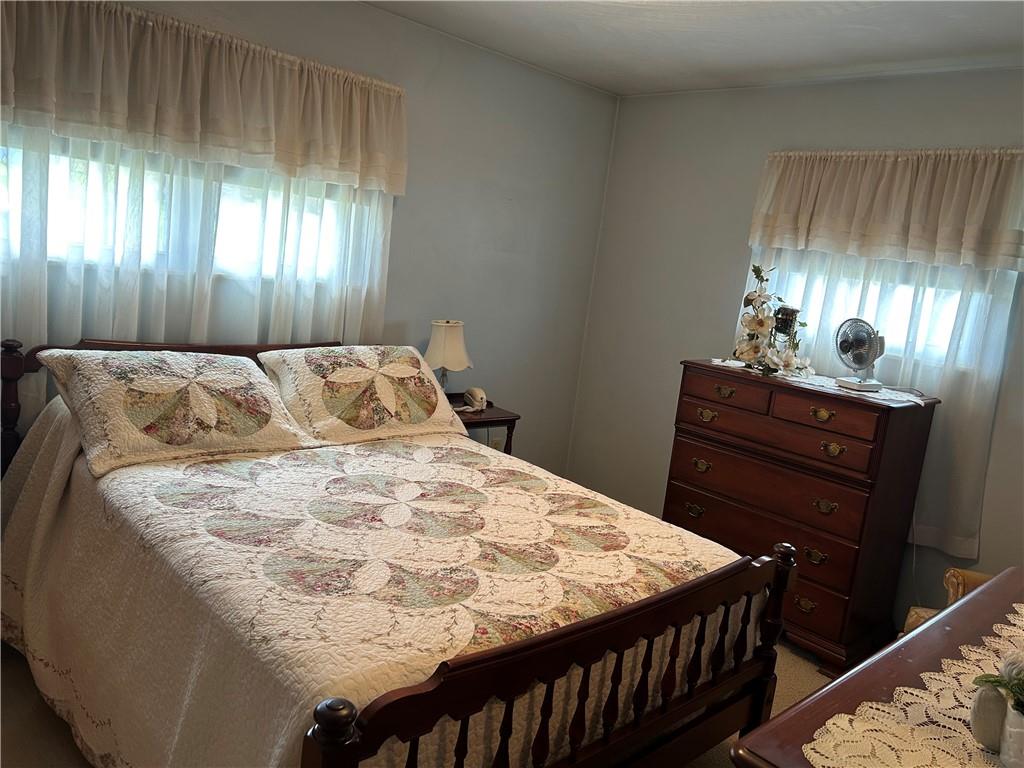356 3rd Street Smithton, PA 15479 - Photo 13 of 21 a bedroom with a bed and a dresser