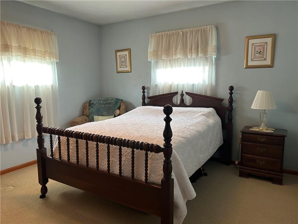 356 3rd Street Smithton, PA 15479 - Photo 14 of 21 a bed sitting in a bedroom next to a window