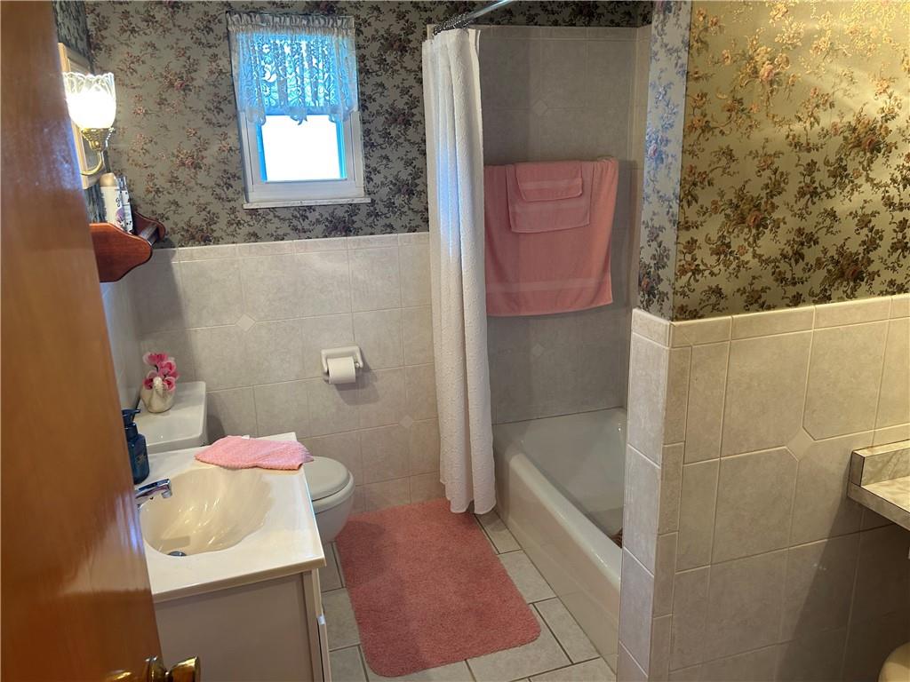 356 3rd Street Smithton, PA 15479 - Photo 16 of 21 a bathroom with a sink toilet and shower