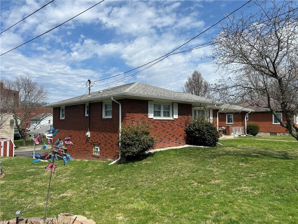 356 3rd Street Smithton, PA 15479 - Photo 2 of 21 a front view of a house with a garden