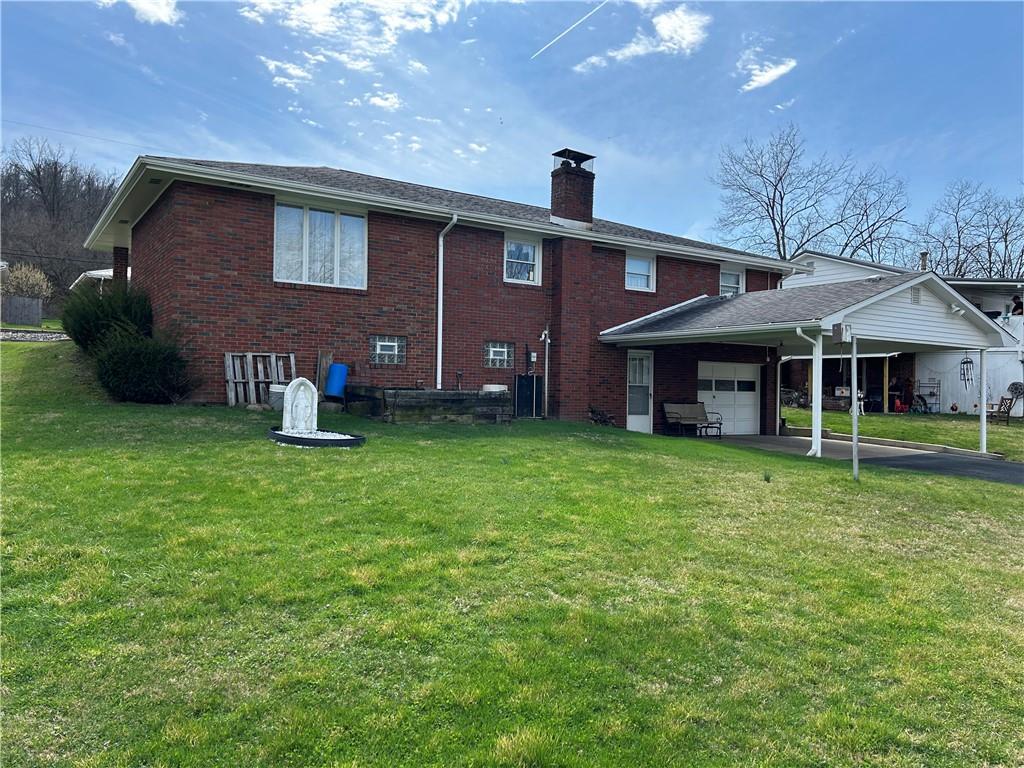 356 3rd Street Smithton, PA 15479 - Photo 4 of 21 a front view of a house with garden