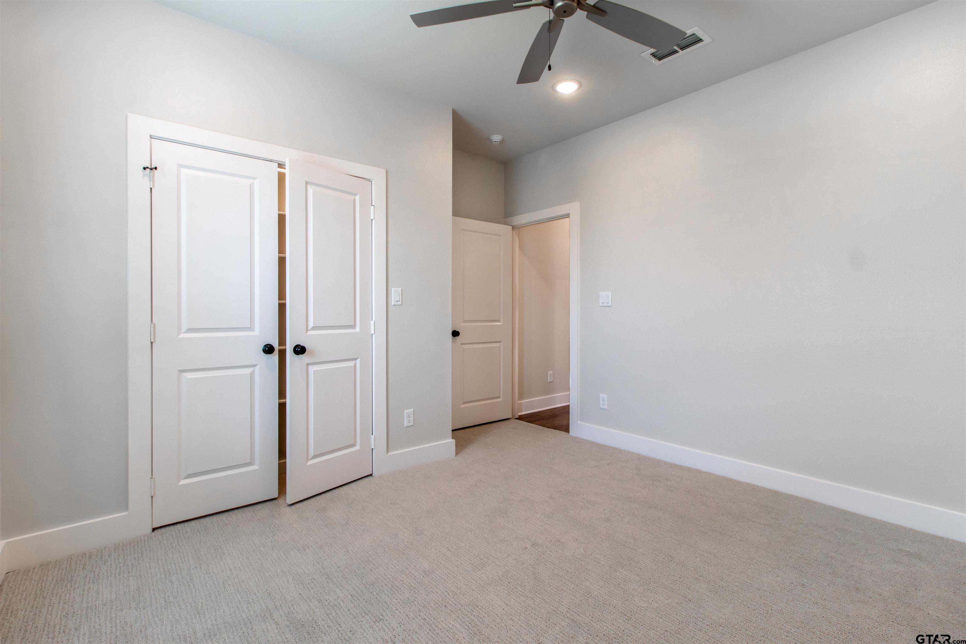 7013 Hillside Avenue Tyler, TX 75707 - Photo 33 of 37 an empty room with closet area