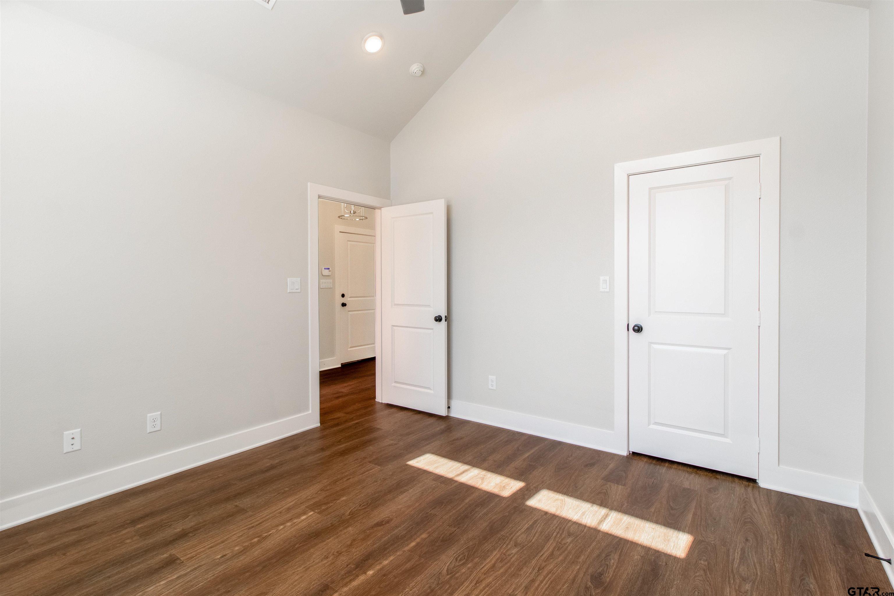 7013 Hillside Avenue Tyler, TX 75707 - Photo 6 of 37 an empty room with wooden floor