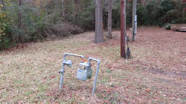 a backyard of a house with lots of green space