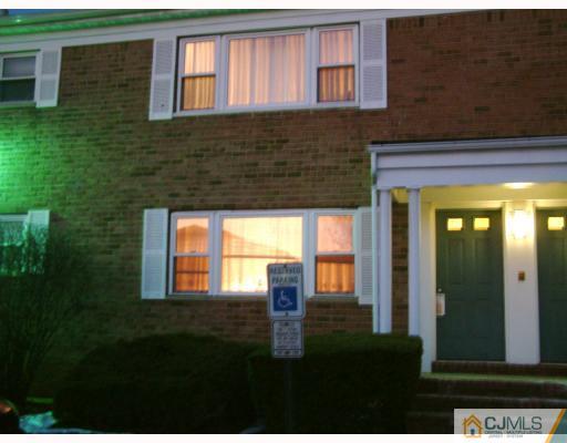 197 Evergreen Road, Unit 7B Edison, NJ 08837 - Photo 1 of 6 a front view of a house with a yard