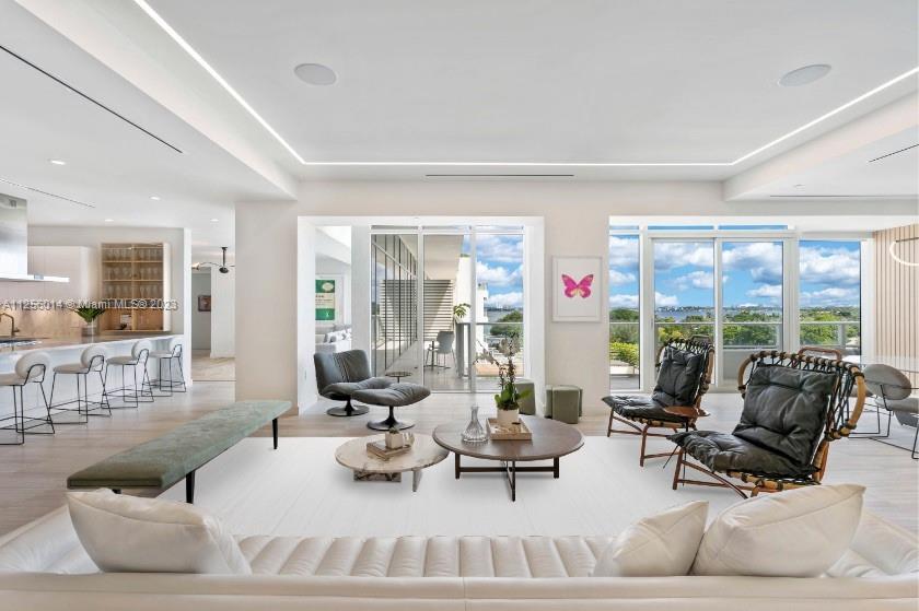 4701 Meridian Avenue, Unit 601 Miami Beach, FL 33140 - Photo 1 of 1 a living room with furniture and large windows