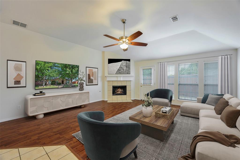a living room with furniture fireplace and window