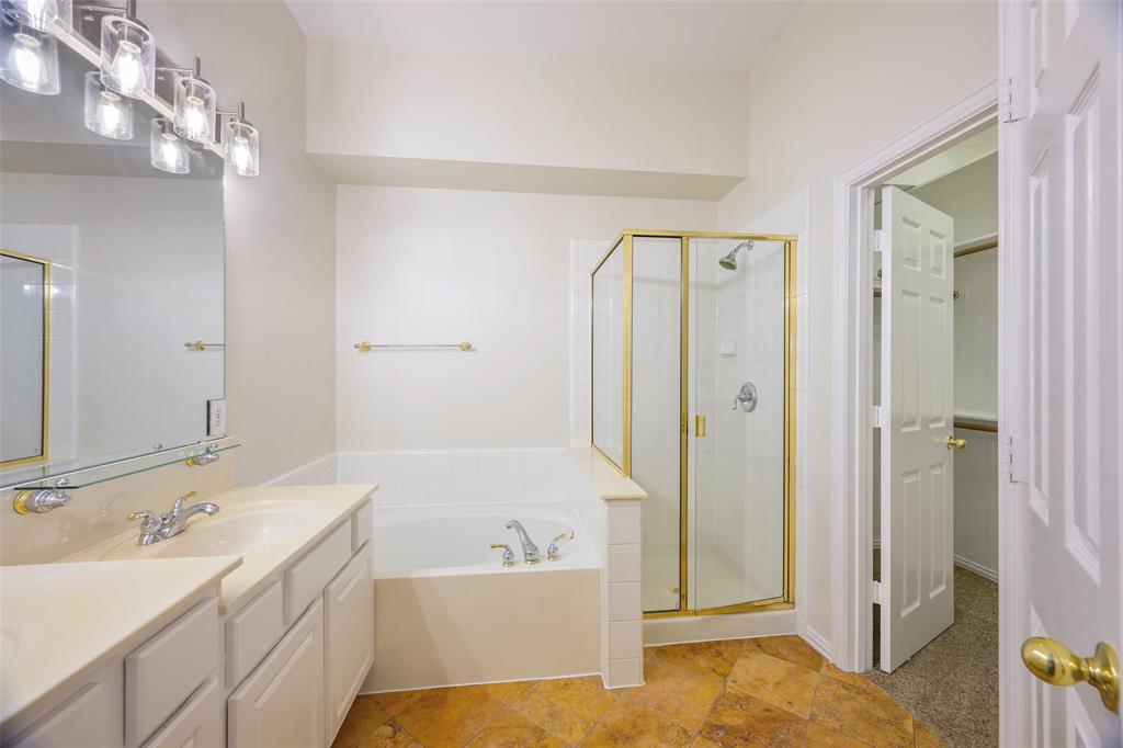 6101 Apache Drive The Colony, TX 75056 - Photo 13 of 24 a bathroom with a tub sink and mirror