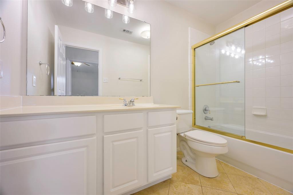 6101 Apache Drive The Colony, TX 75056 - Photo 17 of 24 a bathroom with a sink toilet and shower