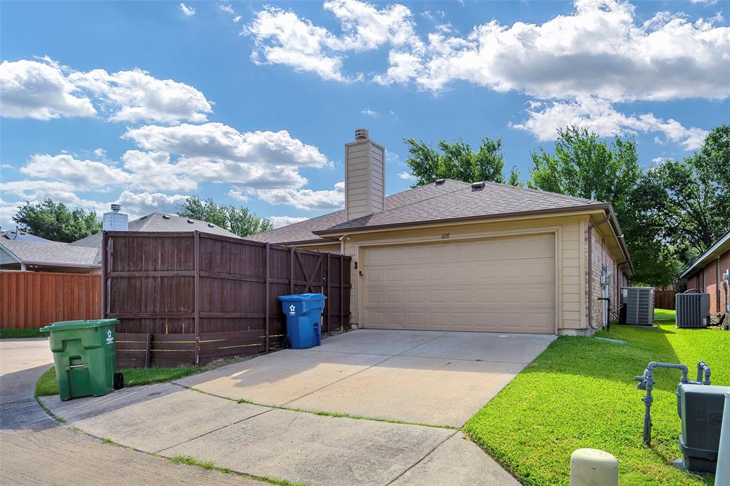 6101 Apache Drive The Colony, TX 75056 - Photo 19 of 24 a front view of a house with garden