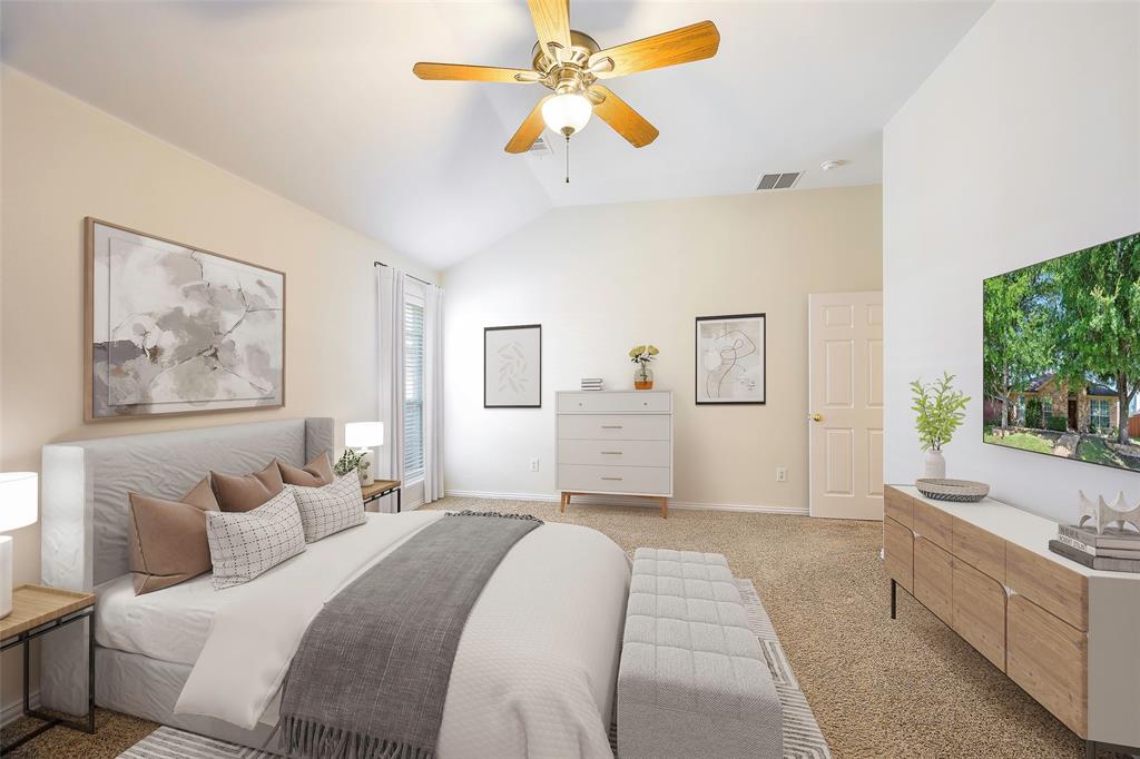 6101 Apache Drive The Colony, TX 75056 - Photo 2 of 24 a spacious bedroom with a large bed a chandelier and a window