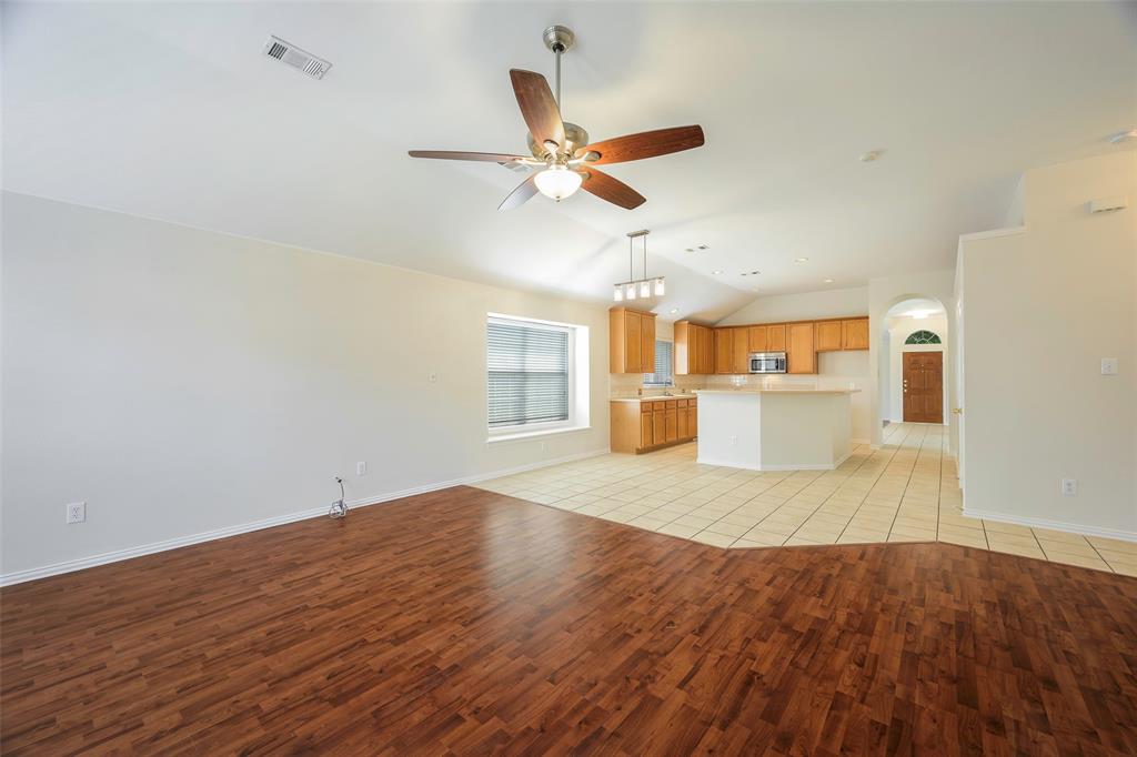 6101 Apache Drive The Colony, TX 75056 - Photo 4 of 24 a view of empty room with wooden floor and ceiling fan