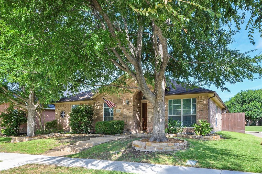 6101 Apache Drive The Colony, TX 75056 - Photo 5 of 24 a view of a house with a yard and tree s