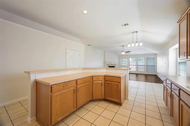 a large kitchen with cabinets and furniture